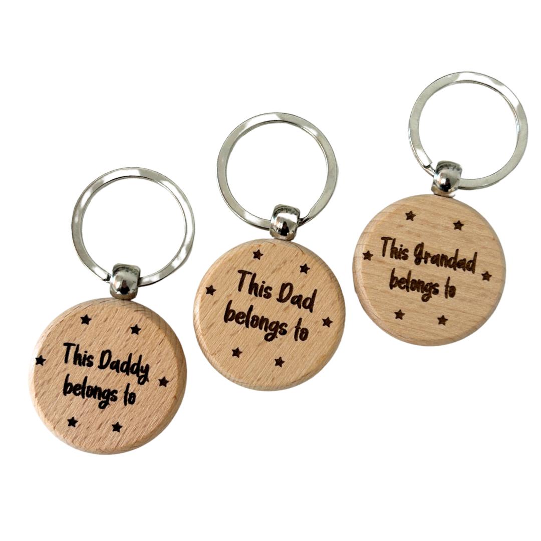 wooden keyring engraved with this daddy belongs to and added names on the reverse