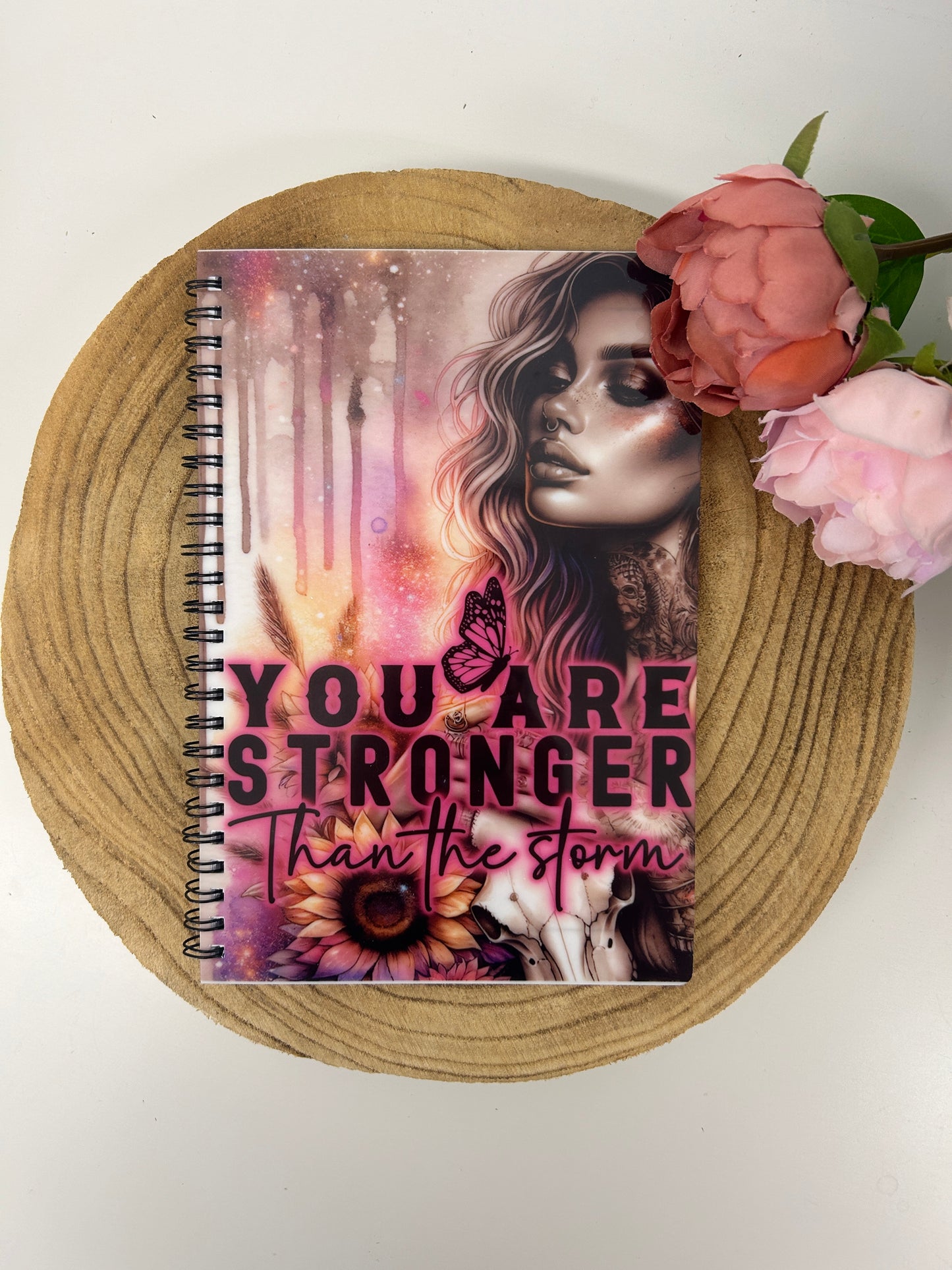 'You are stronger than the storm' notebook
