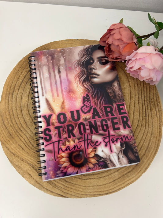 'You are stronger than the storm' notebook