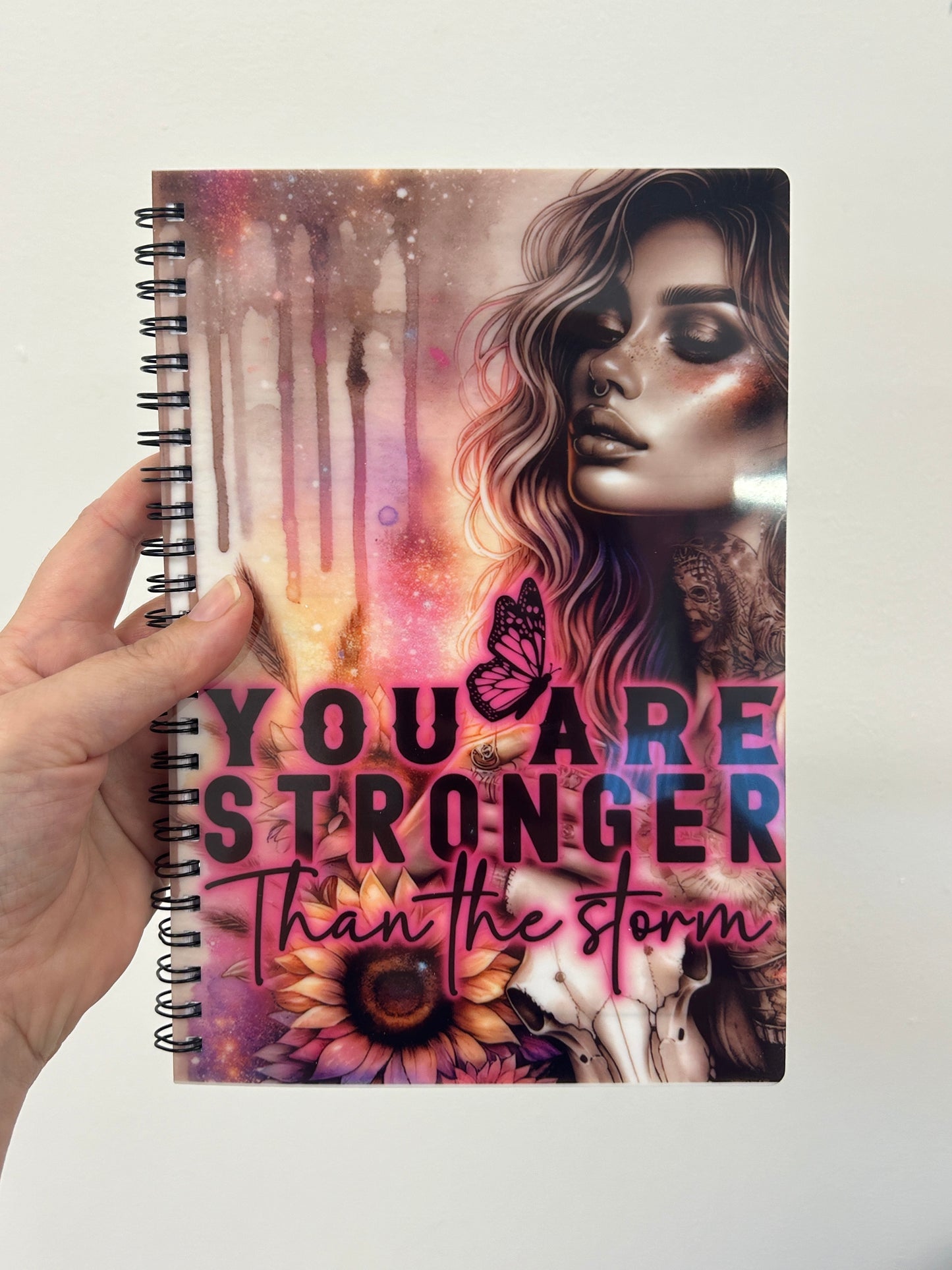 'You are stronger than the storm' notebook