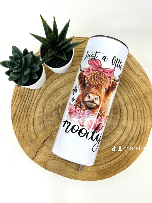 Moody cow drinks tumbler